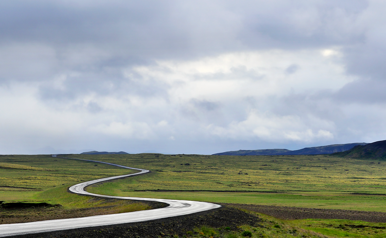Wet asphalt road after seasonal rain, relevant to tire traction